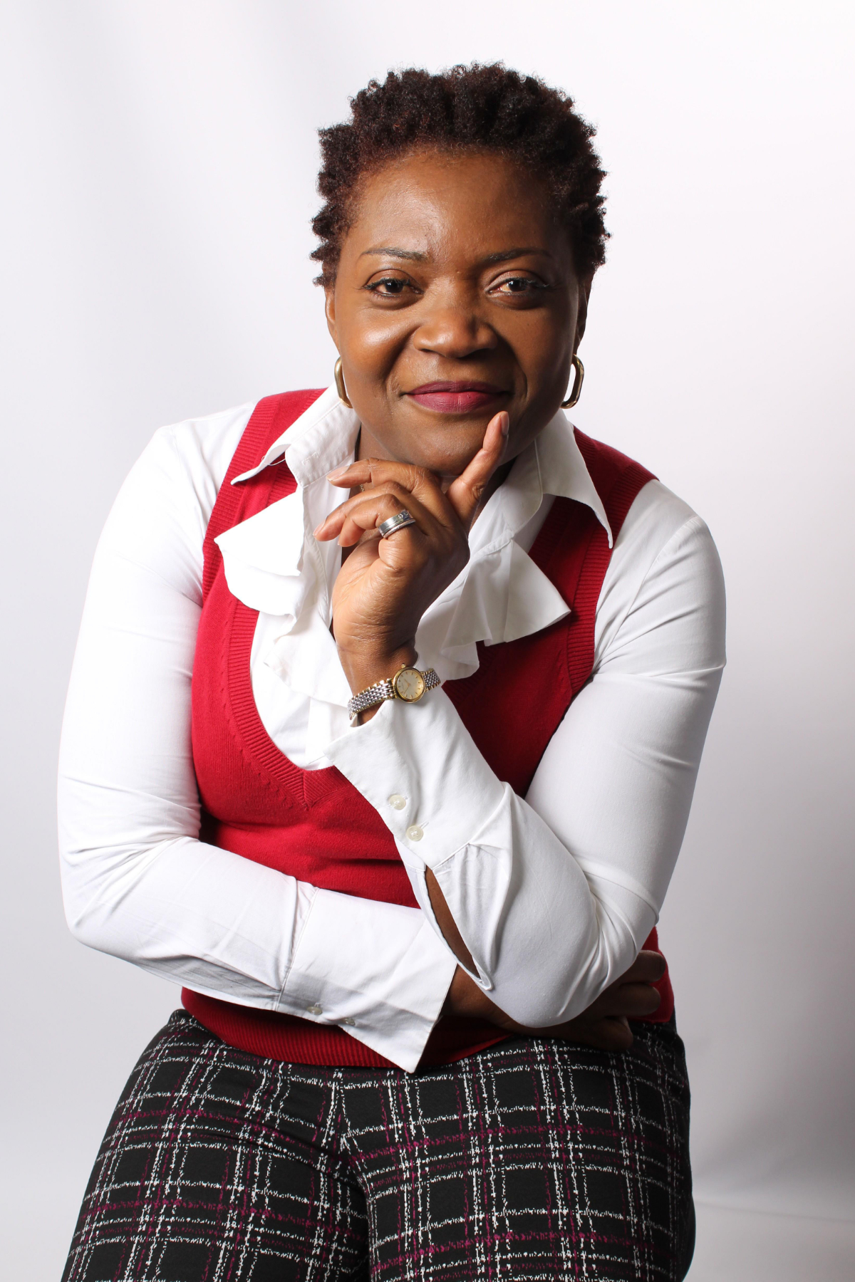 Author Tina Shelton, smiling with her hand resting under her chin